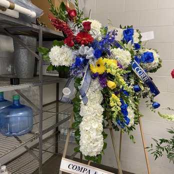 Funeral flowers for less - Cross w/flower spray that represent  Red and Grey- Cincinnati Reds  Blue and silver-Dallas Cowboys  Purple and yellow-Lakers - Florists Near Me - La Mirada, California