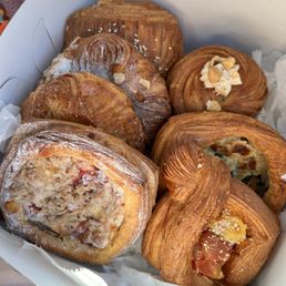 1.Cherry crumble, 2.Kouign Aman, 3.Almond Croissant, 4.Ham & Cheese, 5.Hazelnut Cruffin, 6.Spinach Ricotta, 7.Tomato goat Cheese
