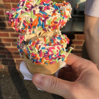 The Scoop Coop - a person holding an ice cream cone with sprinkles - Ice Cream & Frozen Yogurt Near Me - East Hanover, New Jersey The Scoop Coop - a person holding an ice cream cone with sprinkles - Ice Cream & Frozen Yogurt Near Me - East Hanover, New Jersey