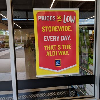 ALDI - a sign in the window of a store - Grocery Near Me - Orlando, Florida ALDI - a sign in the window of a store - Grocery Near Me - Orlando, Florida