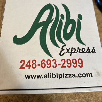 Alibi Express - a pizza box on a counter - Pizza Near Me - Orion Twp, Michigan
