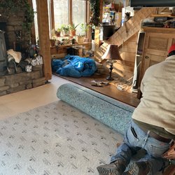 Phil's Carpets & Flooring - Roberto laying the padding