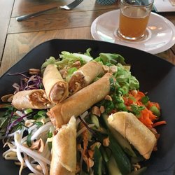 Pho Xpress Foodhouse - Spring roll vermicelli salad. Super crispy spring rolls with fresh salad and herbs. Served with fish sauce in a shot glass.