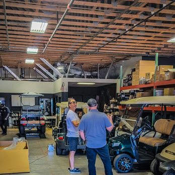 Intermountain Golf Cars - Damian talking with a customer back in the repair/maintenance side - Golf Cart Dealers Near Me - Henderson, Nevada Intermountain Golf Cars - Damian talking with a customer back in the repair/maintenance side - Golf Cart Dealers Near Me - Henderson, Nevada