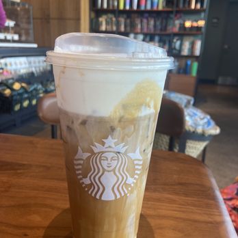 Starbucks - a cup of iced coffee on a table - Coffee & Tea Near Me - Rochester, New York Starbucks - a cup of iced coffee on a table - Coffee & Tea Near Me - Rochester, New York