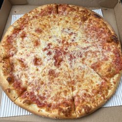 Femi's Pizza - Plain Cheese Pizza - asked for well done. Floppy slices, dough seem a tad raw, bland sauce. Cheese was fresh, stringy, greasy. Below avg.