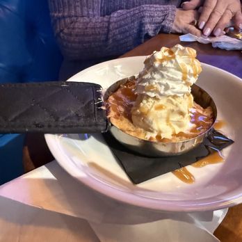 The Porch - 3 ladies split & enjoyed Grannys Skillet Apple Pie $11.00 It was yummy. Served hot & came with a Big dollop of whipped cream on top too! - Bars Near Me - Gilbert, Arizona