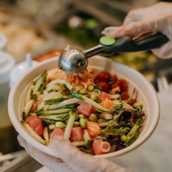 Hawaii Poke Bowl - a person holding a bowl of food - Hawaiian Near Me - Eau Claire, Wisconsin Hawaii Poke Bowl - a person holding a bowl of food - Hawaiian Near Me - Eau Claire, Wisconsin