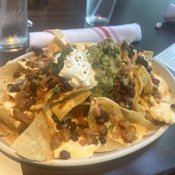 Culinary Dropout - BBQ PORK BELLY nachos (black bean, guacamole, sour cream, pico de gallo) - New American Near Me - Atlanta, Georgia Culinary Dropout - BBQ PORK BELLY nachos (black bean, guacamole, sour cream, pico de gallo) - New American Near Me - Atlanta, Georgia