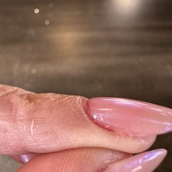 Shimmer Nail Spa - Red polish on the edges of my nails showing through