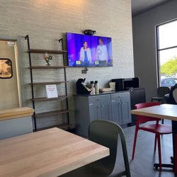 TV but nobody is paying attention, area to fix your coffee if you didn't request it when you ordered and pickup area for DoorDash.