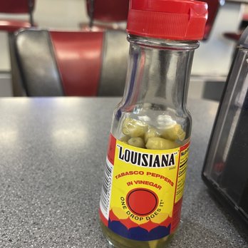 Big Time Diner - a jar of pickles on a table - American Near Me - Mobile, Alabama
