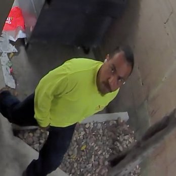 Alpha Demolition - Uniformed worker looking into camera before peeing on a garage in our complex. - Demolition Services Near Me Alpha Demolition - Uniformed worker looking into camera before peeing on a garage in our complex. - Demolition Services Near Me
