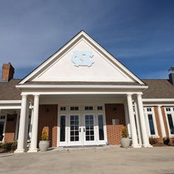 The UNC Finley Golf Club - Outside the clubhouse. Patio and one of the entrances from the parking lot.