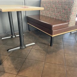 Filthy. The floor looks as if it has never been swept or mopped in weeks.