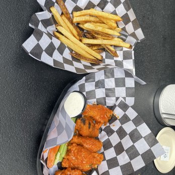 The Bar - Uptown - Half lb. Traditional Buffalo wings and half order of fries - Sports Bars Near Me - Phoenix, Arizona