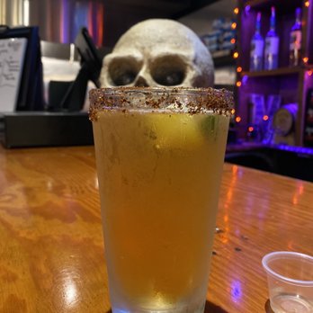 Jack's Tavern - Headie trying to steal a sip of Dos Equis (can't say I blame him) - Sports Bars Near Me - Denton, Texas