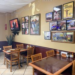 Las Brasas Méxican Restaurant - Corner with seating and photos displayed