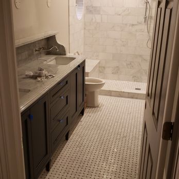 Prudential Solutions - a bathroom with a sink, toilet, and shower - General Contractors Near Me - Barrington, Illinois
