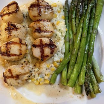 Seasons 52 - Caramelized Grilled Sea Scallops with summer corn mascarpone risotto . Delicious! - New American Near Me - Altamonte Springs, Florida Seasons 52 - Caramelized Grilled Sea Scallops with summer corn mascarpone risotto . Delicious! - New American Near Me - Altamonte Springs, Florida