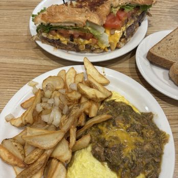 The Coffee Cup - Top: OG Breakfast Sandwich with Croissant bread Bottom: Pork Chili Verde Omelette - Diners Near Me - Boulder City, Nevada