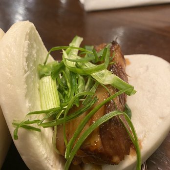 Marumen - One of two Pork Buns Plate. Green oinion. Only one small cucumber under the pork slice. - Ramen Near Me - Fairfax, Virginia