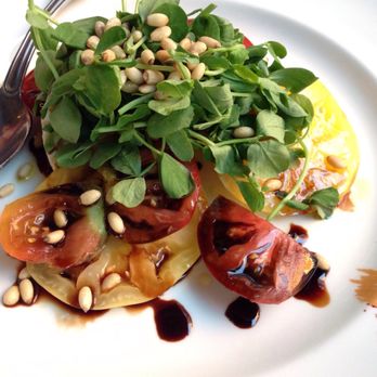 Henrietta's Table - Heirloom tomatoes, farm mozzarella in balsamic reduction topped with toasted pine nuts, delicious and fresh! - New American Near Me - Cambridge, Massachusetts Henrietta's Table - Heirloom tomatoes, farm mozzarella in balsamic reduction topped with toasted pine nuts, delicious and fresh! - New American Near Me - Cambridge, Massachusetts