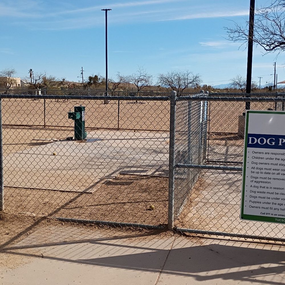 Udall Park - Book bag, rules, double gated entry area and a water fountain in the back - Dog Parks Near Me - Tucson, Arizona