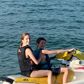 Lake Georgetown - me and my brother on a Jetske with the beautiful Georgetown blue water lake - Lakes Near Me - Georgetown, Texas