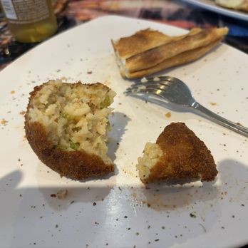 Super Sardo's Pizza - Sorry for the half eaten Arancini.  Look at the size compared to the fork - Pizza Near Me - Largo, Florida