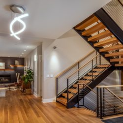 Art lighting on the walls, recessed can lighting, LED tape lighting in the mantle and of course the spectacular modern chandelier.