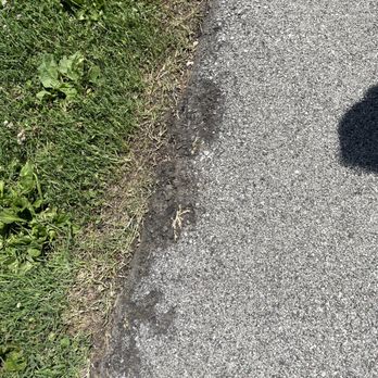 JB'S ASPHALT SEALCOATING - the shadow of a person on a sidewalk - General Contractors Near Me JB'S ASPHALT SEALCOATING - the shadow of a person on a sidewalk - General Contractors Near Me