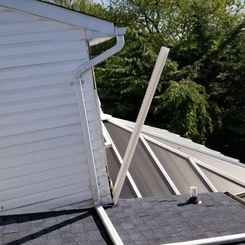 Flat Roof Solutions - siding falling off - Roofing Near Me