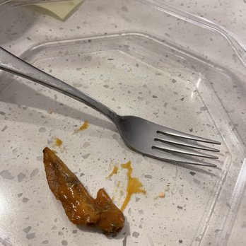 Wild Wing Cafe - This was considered a wing!  No meat just bone! - Chicken Wings Near Me - Gainesville, Georgia
