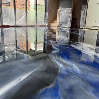 Prime Time Resins - a living room with a blue floor - Flooring Near Me Prime Time Resins - a living room with a blue floor - Flooring Near Me