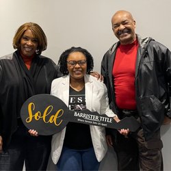 Barrister Title - New Home Owner (center) with proud parents!