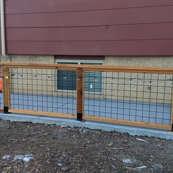 RG Services - a fenced in area with a car parked in the driveway - Masonry/Concrete Near Me - Denver, Colorado