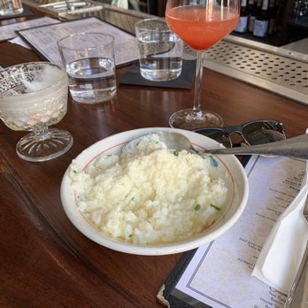 The Delta - Parmesan Grits and half-empty (or full ) Bellini - Southern Near Me - Chicago, Illinois The Delta - Parmesan Grits and half-empty (or full ) Bellini - Southern Near Me - Chicago, Illinois