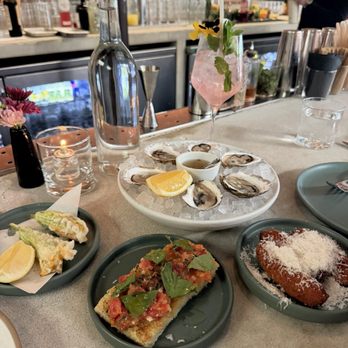 Market - Oysters, squash blossoms, heirloom tomato focaccia, Suppli - all happy hour items - Italian Near Me - Los Angeles, California Market - Oysters, squash blossoms, heirloom tomato focaccia, Suppli - all happy hour items - Italian Near Me - Los Angeles, California