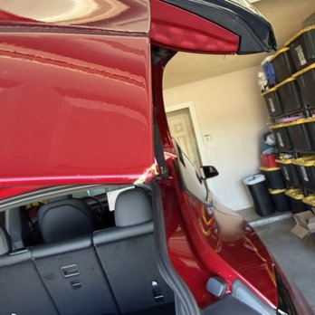 A Darker Shade - Bad rolled back corners everywhere.  This one still had his green microfiber cloth under it. - Car Window Tinting Near Me - Phoenix, Arizona