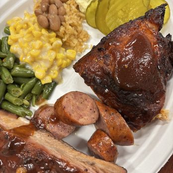 B&B Smokehouse - Plate with Creamed Corn, pork ribs, Green Beans, Potato Salad, beans, BBQ Chicken - Barbeque Near Me - San Antonio, Texas
