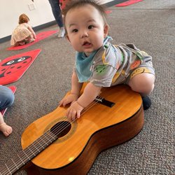Ladybug Music - Playing with the guitar after class
