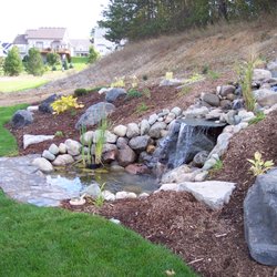 Family Affair Landscape - Waterfall using Fieldstone boulders and Flagstone for the falls