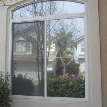 Sun Solutions Window Tinting - Outside view of front window. Notice it provides a nice reflection of neighbors house. - Home Window Tinting Near Me Sun Solutions Window Tinting - Outside view of front window. Notice it provides a nice reflection of neighbors house. - Home Window Tinting Near Me