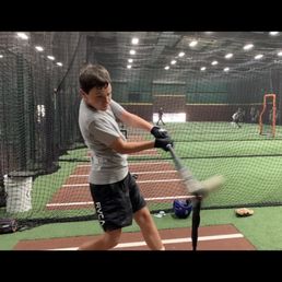 Son practicing off the tee. Great warm up before the live pitch. Son practicing off the tee. Great warm up before the live pitch.