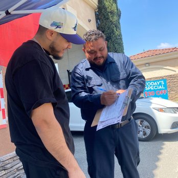 Manny's Smog - Rosalio explaining the paperwork - Smog Check Stations Near Me - Moreno Valley , California