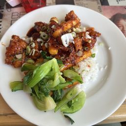 Korean Fried chicken with rice cake, add bok choy. Korean Fried chicken with rice cake, add bok choy.