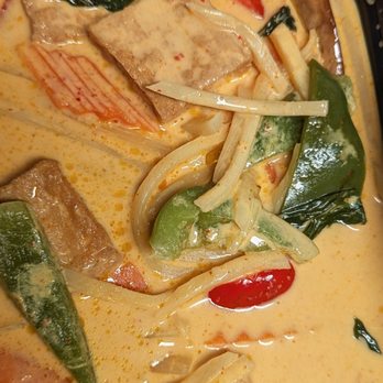 Eggs & Thai Café - 57. Red Curry Dinner with fried tofu (too mild on spice) - A Thai red curry dish featuring fried tofu, bell peppers, and vegetables in a creamy, spicy sauce. - Thai Near Me - Dedham, Massachusetts