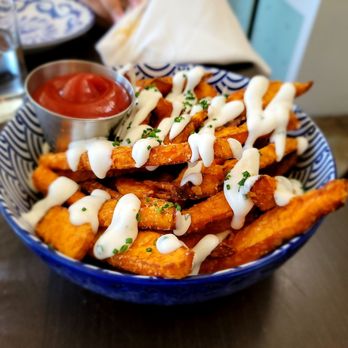 Basic Kitchen - SWEET POTATO FRIES vegan ranch, chives - New American Near Me - Charleston, South Carolina Basic Kitchen - SWEET POTATO FRIES vegan ranch, chives - New American Near Me - Charleston, South Carolina