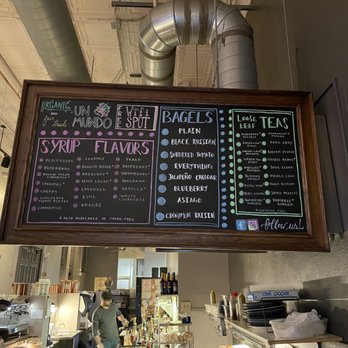 Un Mundo Cafe - The board telling you about the different flavorings, varieties of bagels, and the teas available. - Cafes Near Me - Springfield, Ohio Un Mundo Cafe - The board telling you about the different flavorings, varieties of bagels, and the teas available. - Cafes Near Me - Springfield, Ohio